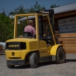 Forklift Moving Logs