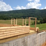 Poured Basement Walls and Log Stack