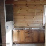 bath cabinets against log wall