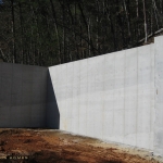 combination foundation and retaining wall