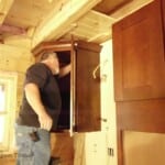 installing kitchen cabinets in log home