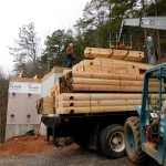 logs-unloaded-small-truck