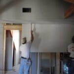 sheetrock trimmed around timber
