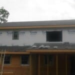 Shingles Being Put on Rear of House