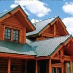 Dormers of a log home with a green roof