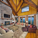 Timber Home Great Room with Stone Fireplace