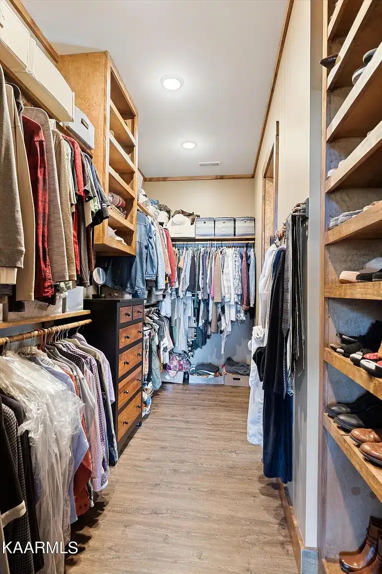 Walk in closet with built in drawers for storage for shoes and storage