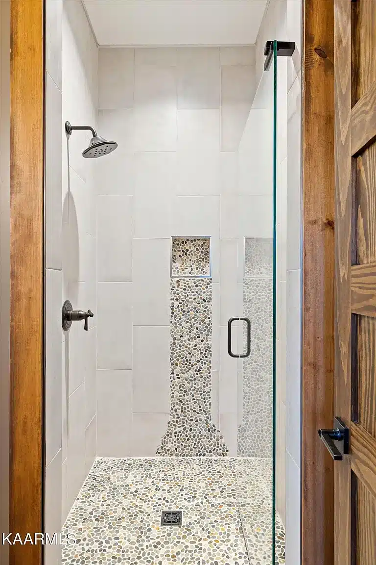 Tile shower with built in soap dish and added interest in tile design