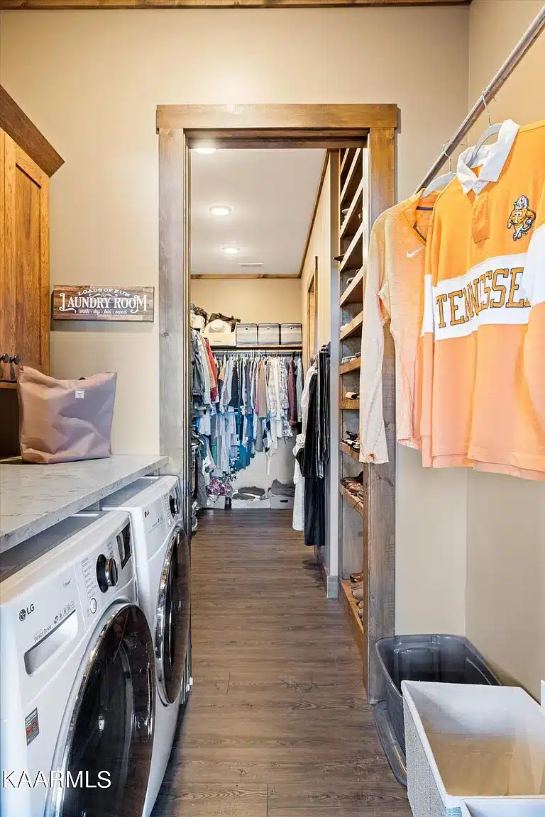 laundry room with front loading and attached closet