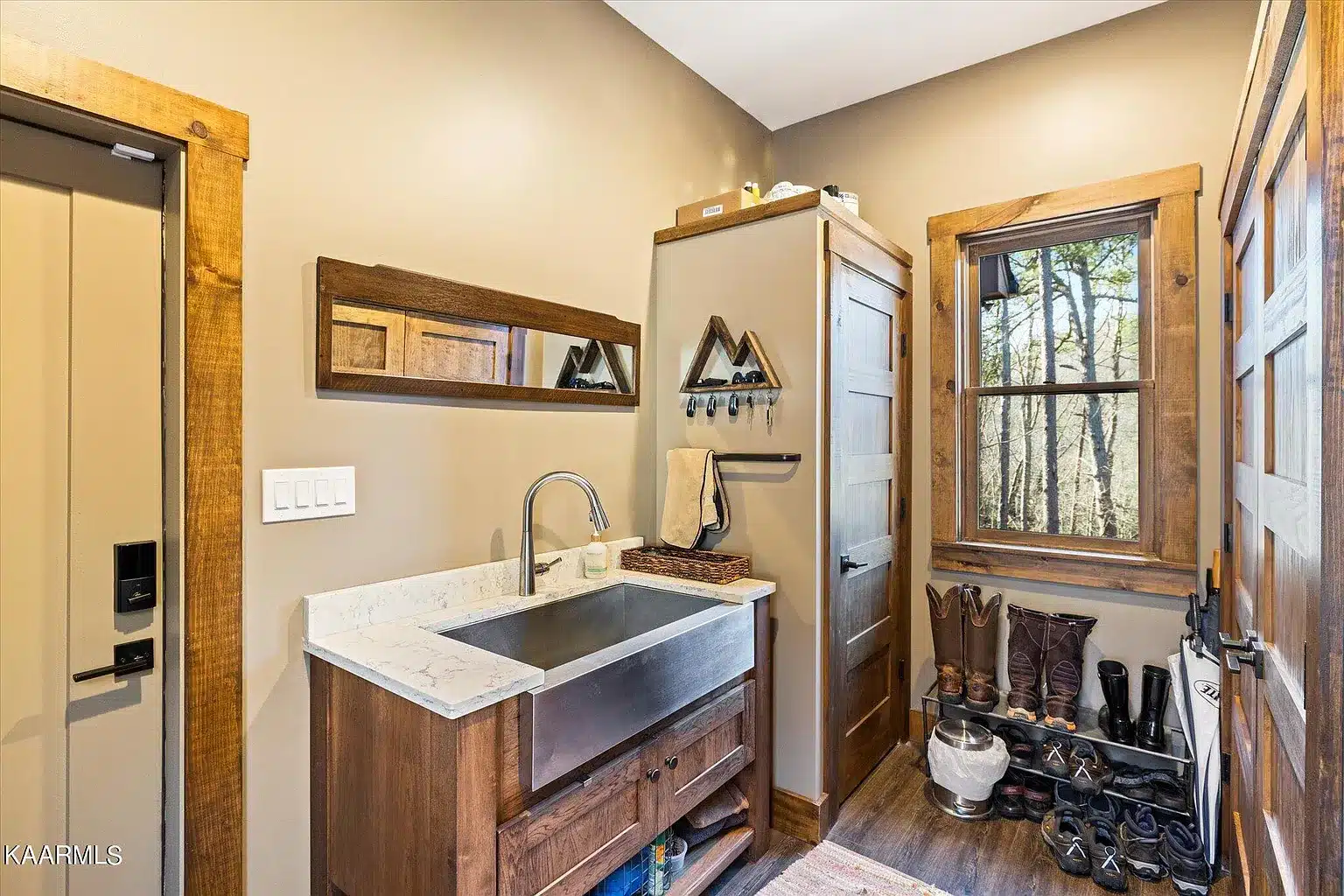 Mudroom with sink and storage for shoes and easy to clean flooring